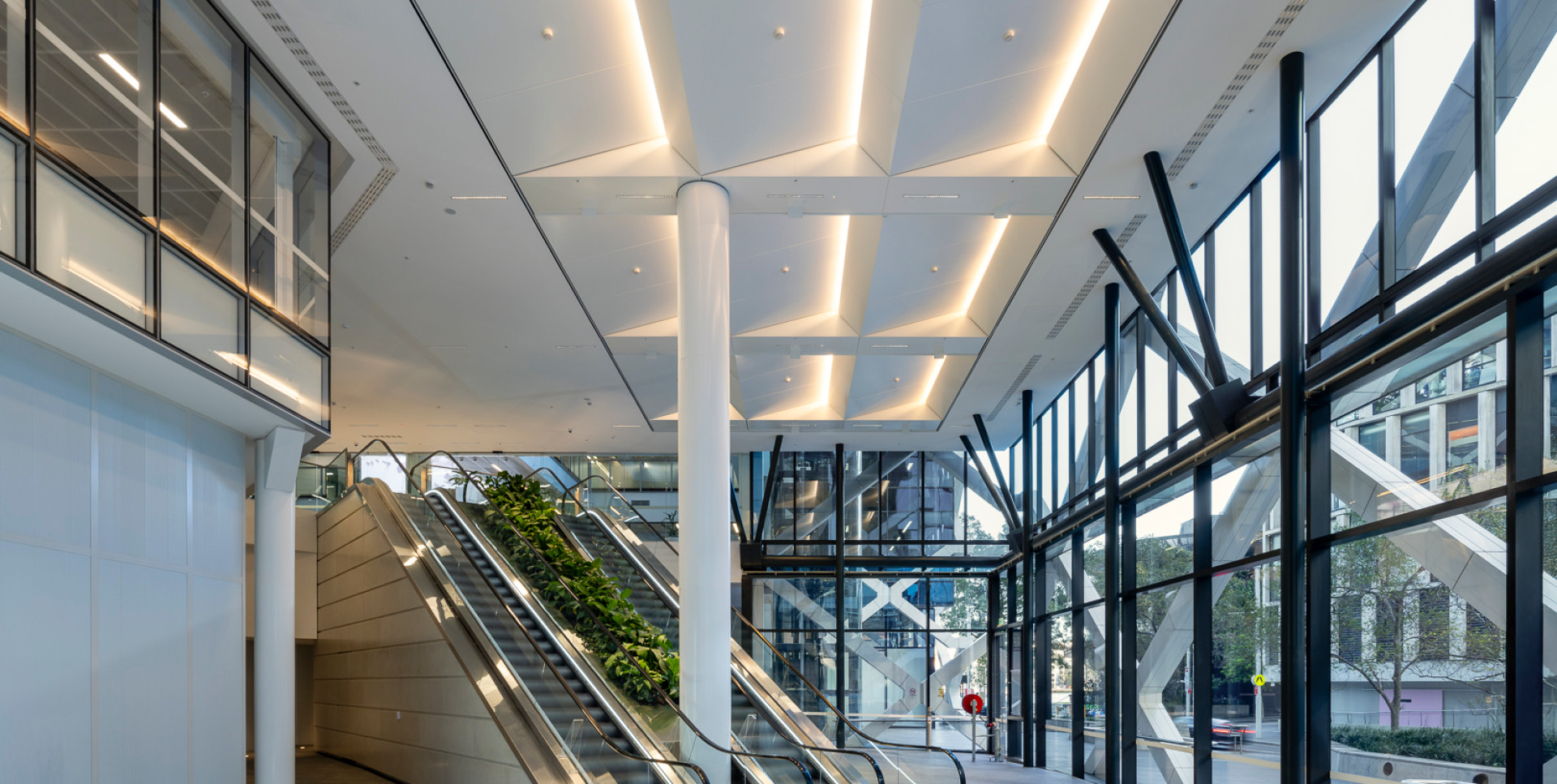 Enterprise 310 metal panel feature ceiling installed at 1 Shelley St Lobby.